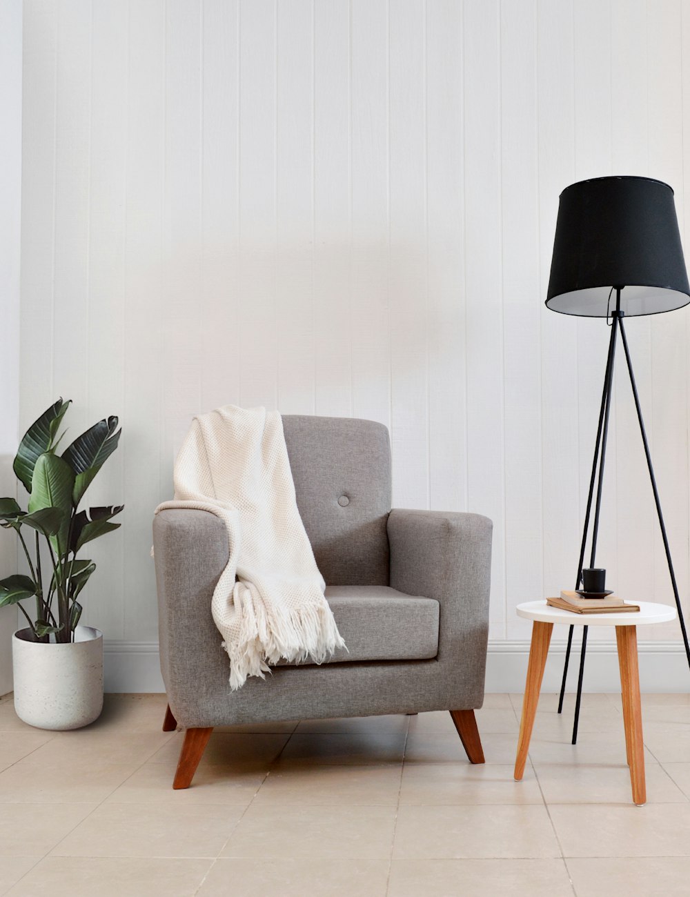 Grey armchair with throw